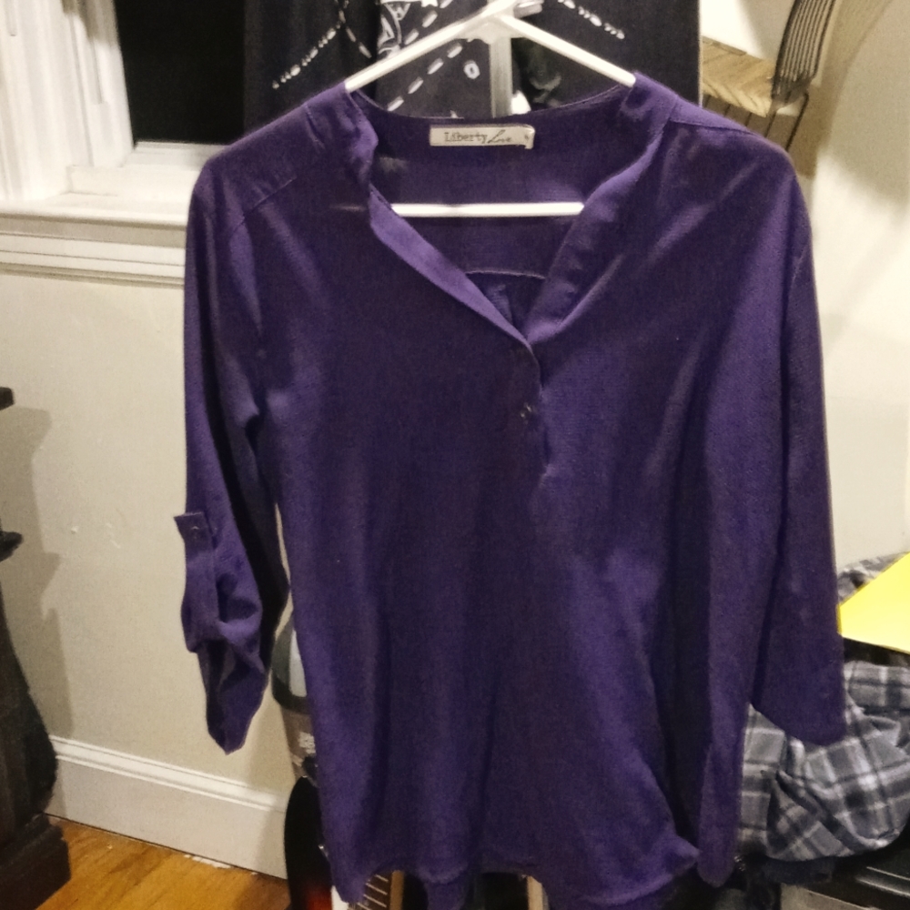 Purple with three buttons down the front nice and Light size medium